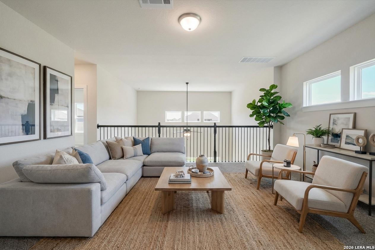 444 Foxbrook Way Cibolo, TX 78108 - Photo 10 of 17 a living room with furniture and a potted plant
