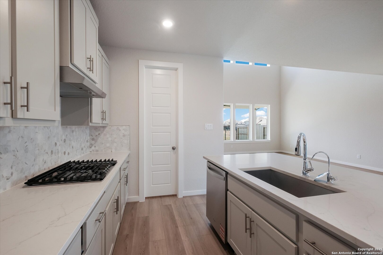 444 Foxbrook Way Cibolo, TX 78108 - Photo 10 of 32 a kitchen that has a sink and a stove