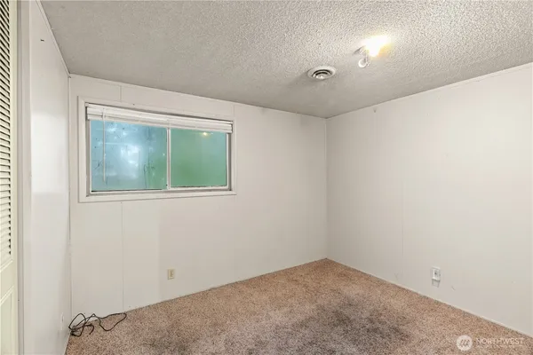 a white toilet sitting next to a bath tub and shower