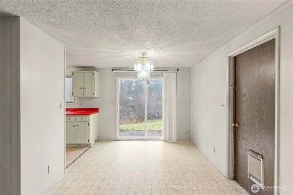 a view of a kitchen with a sink and a fireplace