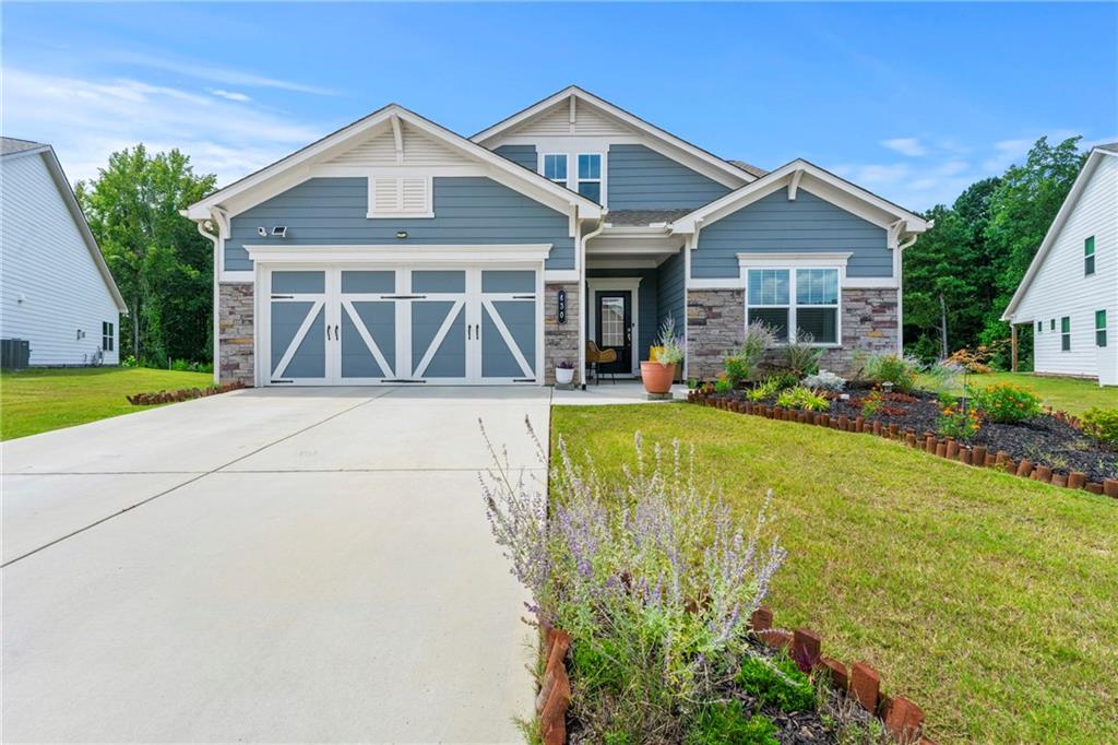 430 Plainfield Street Fayetteville, GA 30215 - Photo 1 of 21 a front view of a house with garden