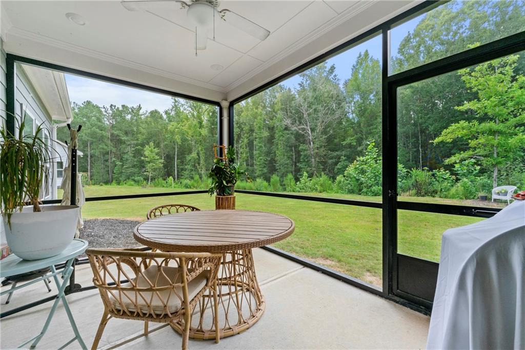 430 Plainfield Street Fayetteville, GA 30215 - Photo 19 of 21 a view of a patio with a table chairs and a table