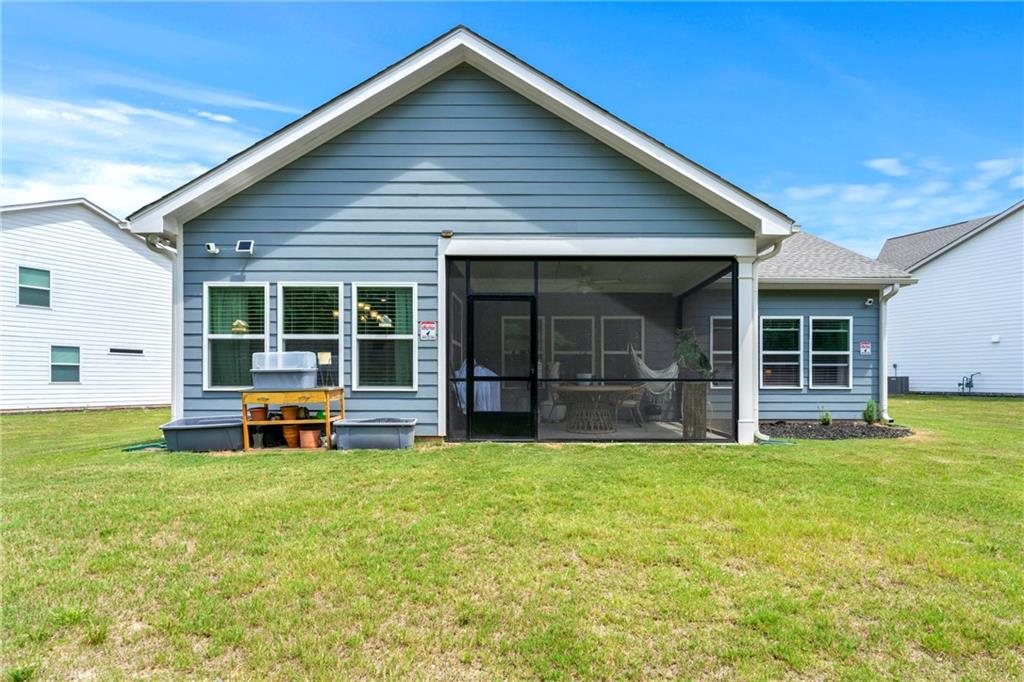 430 Plainfield Street Fayetteville, GA 30215 - Photo 20 of 21 a view of a house with a yard and sitting area