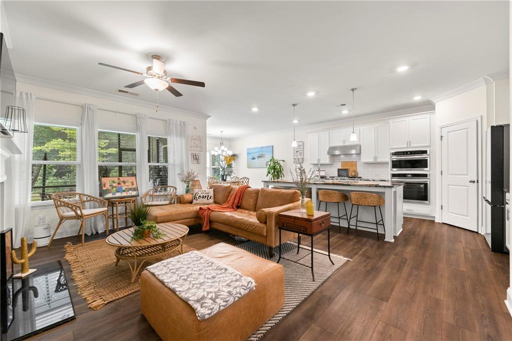 430 Plainfield Street Fayetteville, GA 30215 - Photo 7 of 21 a living room with furniture kitchen view and a large window