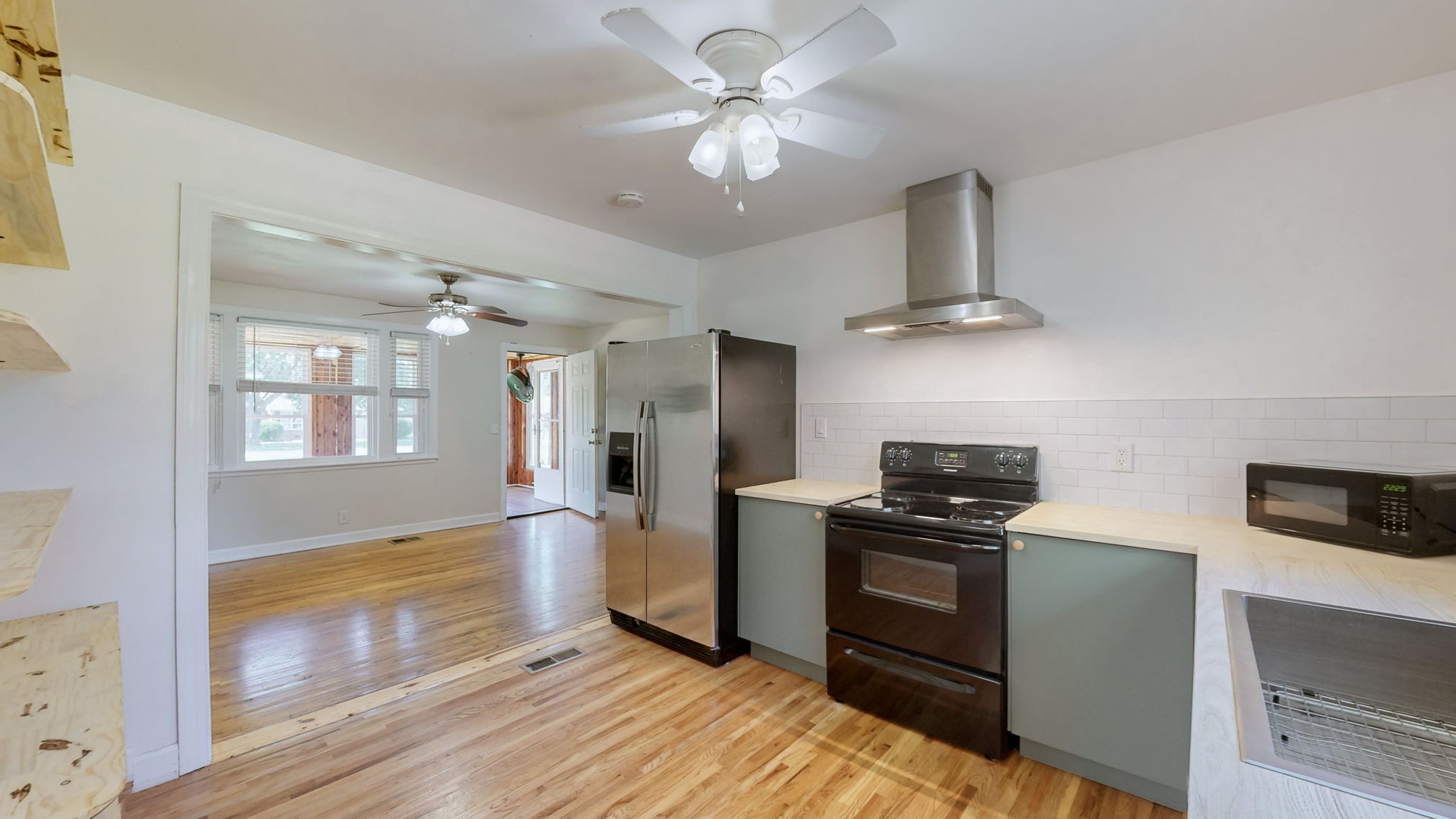 1007 Hunt Street Murfreesboro, TN 37130 - Photo 12 of 58 a kitchen with stainless steel appliances a stove a refrigerator and a microwave