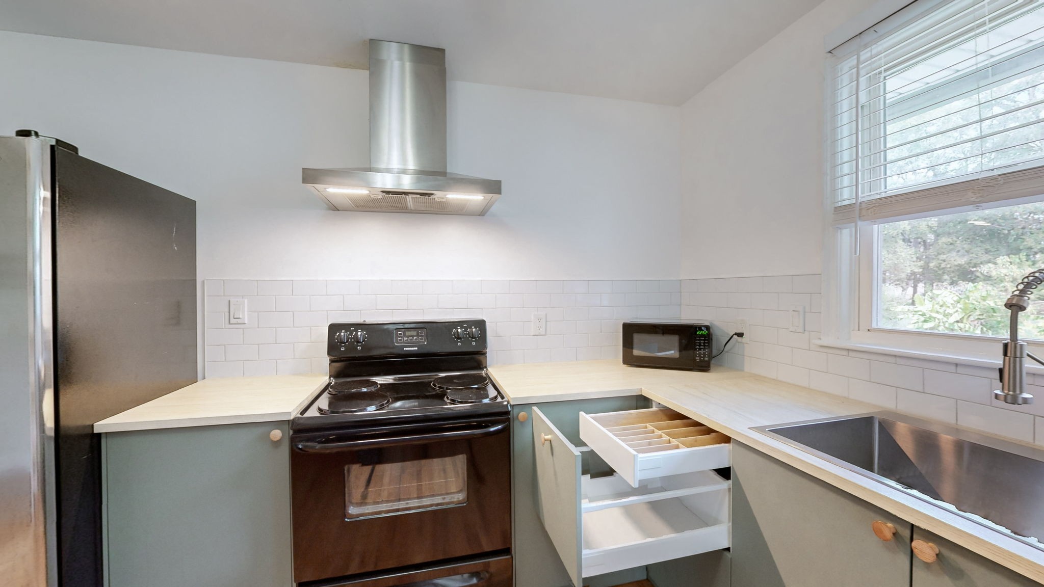 1007 Hunt Street Murfreesboro, TN 37130 - Photo 16 of 58 a kitchen with a stove and a sink