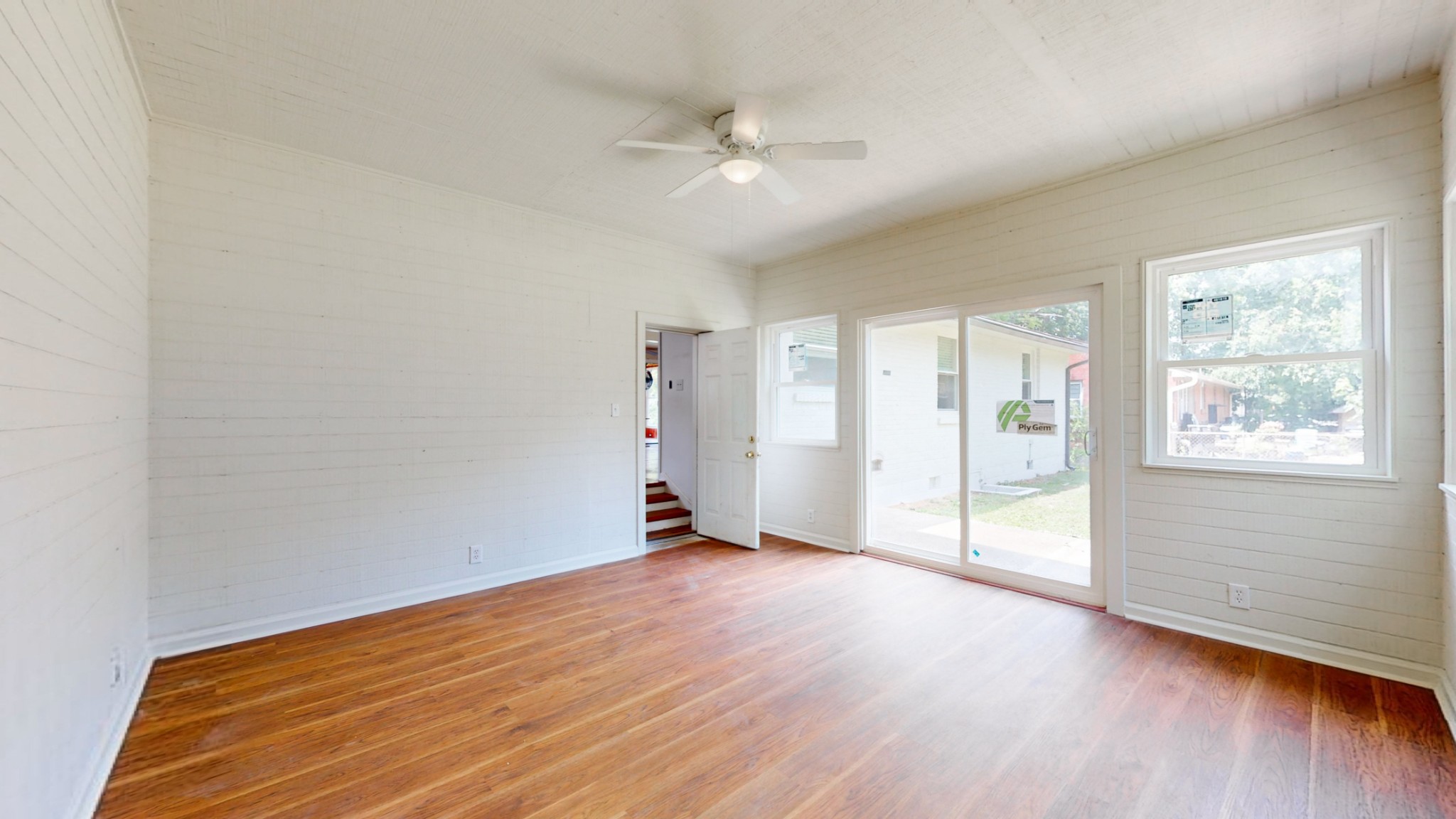 1007 Hunt Street Murfreesboro, TN 37130 - Photo 28 of 58 an empty room with wooden floor fan and windows