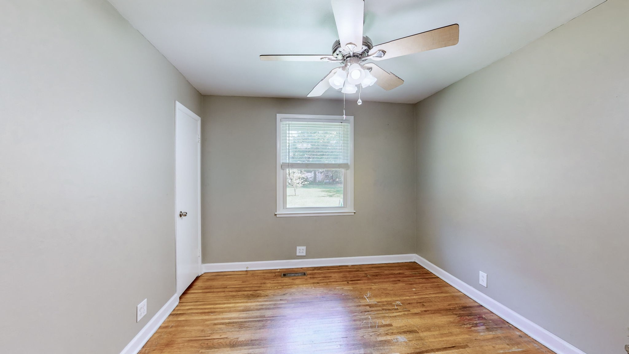 1007 Hunt Street Murfreesboro, TN 37130 - Photo 30 of 58 a view of an empty room with wooden floor and a window