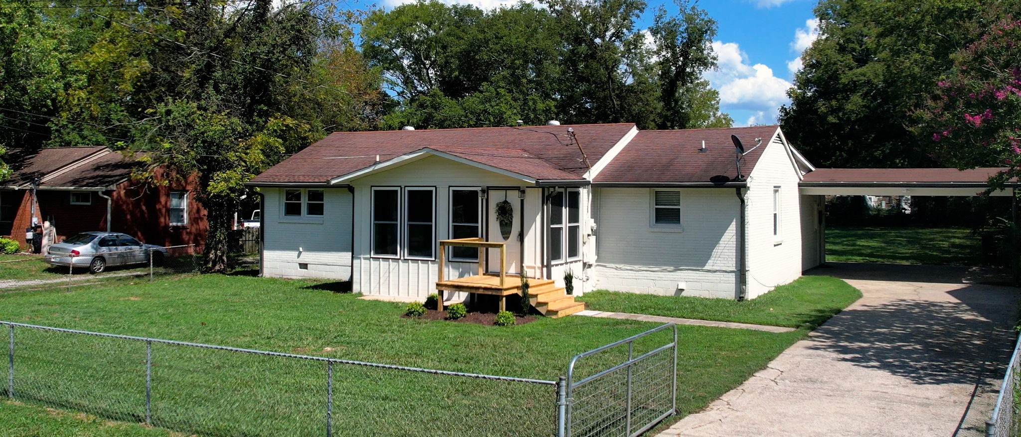 1007 Hunt Street Murfreesboro, TN 37130 - Photo 3 of 58 a front view of a house with a yard table and chairs