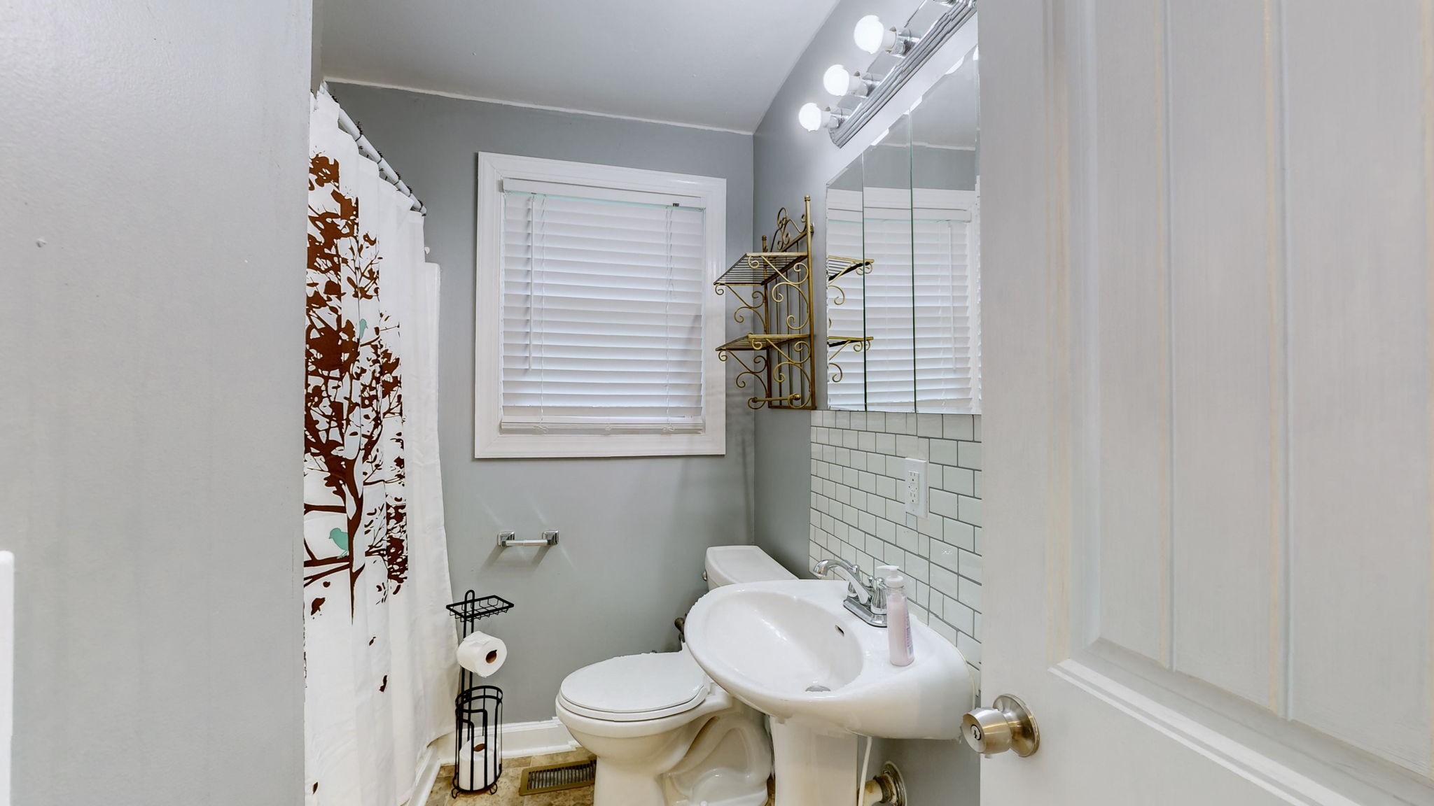 1007 Hunt Street Murfreesboro, TN 37130 - Photo 33 of 58 a bathroom with a sink toilet and shower
