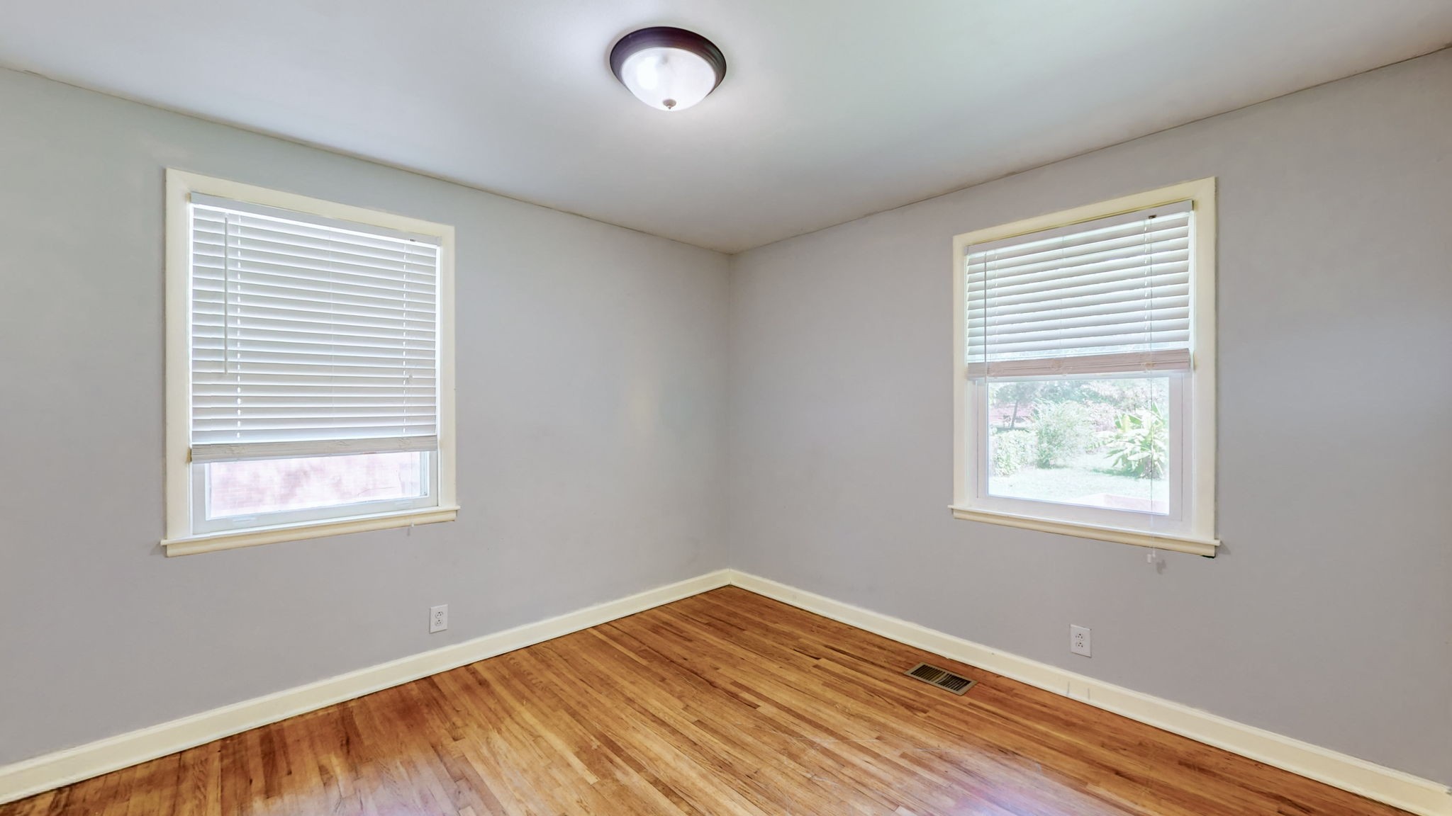 1007 Hunt Street Murfreesboro, TN 37130 - Photo 37 of 58 a view of an empty room with wooden floor and a window
