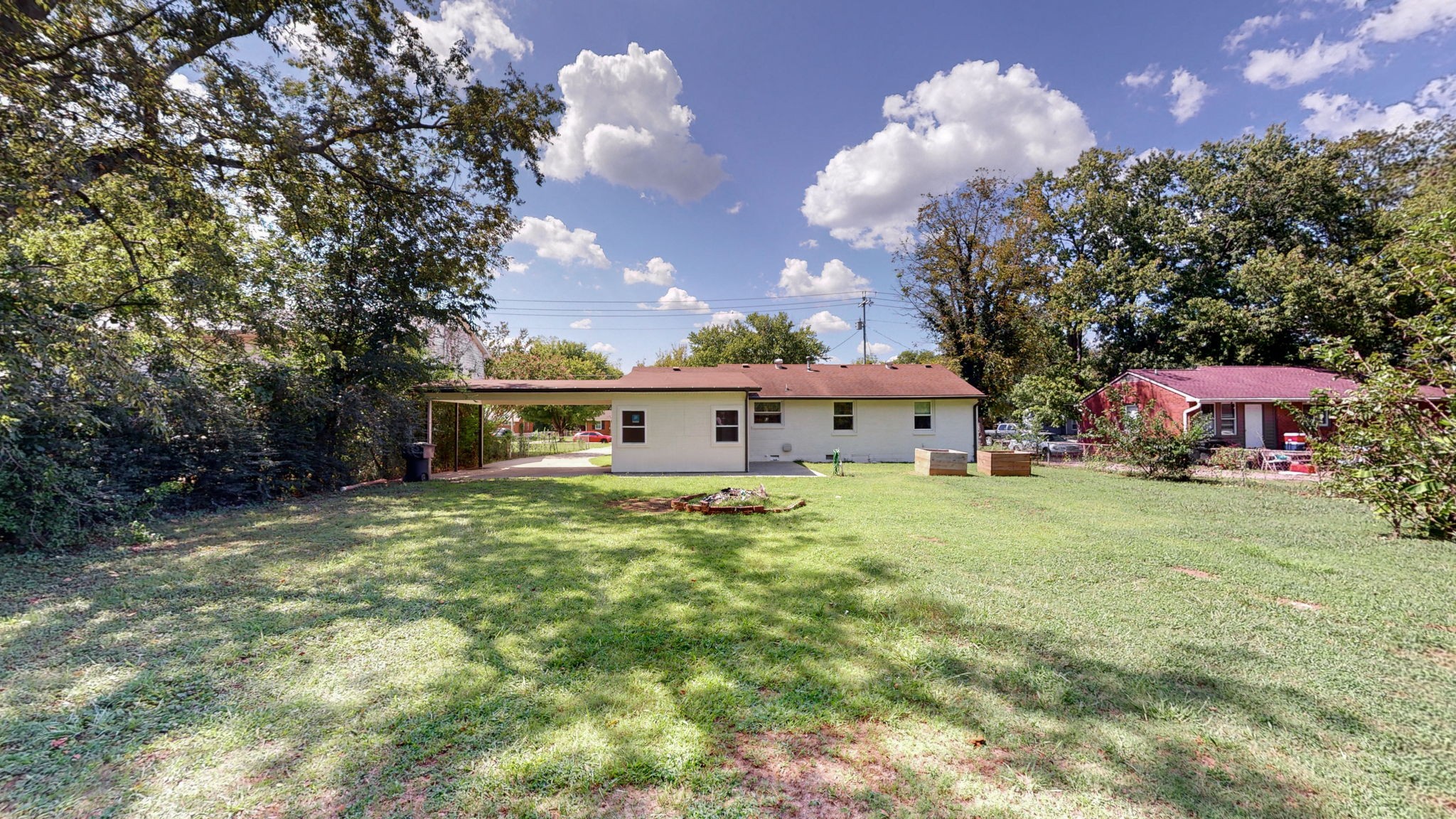 1007 Hunt Street Murfreesboro, TN 37130 - Photo 4 of 58 a view of a house with a yard and a large tree