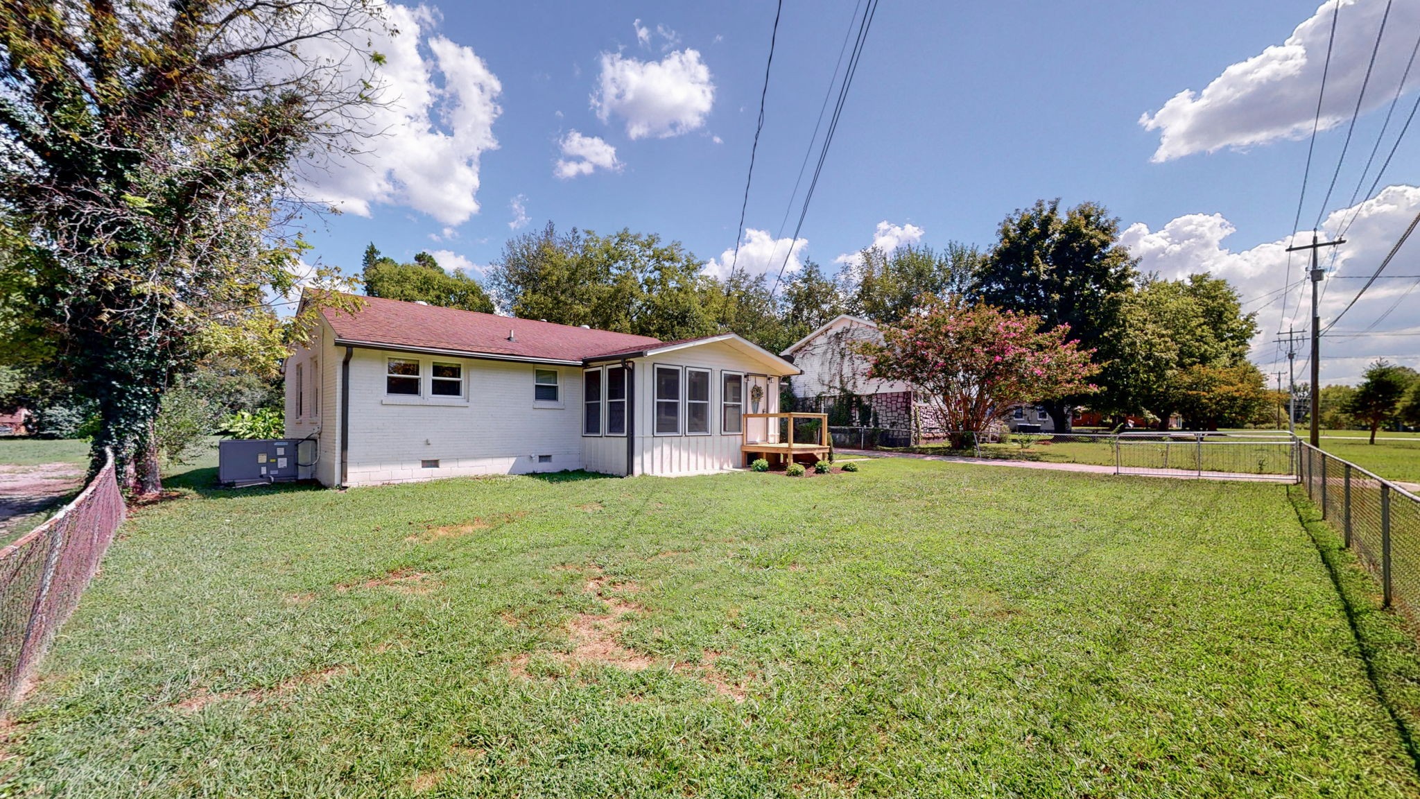 1007 Hunt Street Murfreesboro, TN 37130 - Photo 41 of 58 a view of a house with a big yard potted plants and large tree