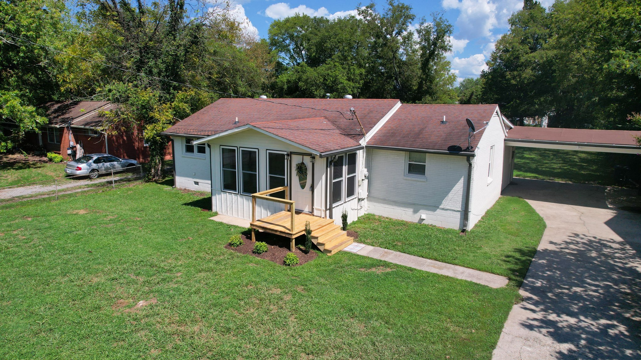 1007 Hunt Street Murfreesboro, TN 37130 - Photo 43 of 58 a front view of a house with a garden and sitting area