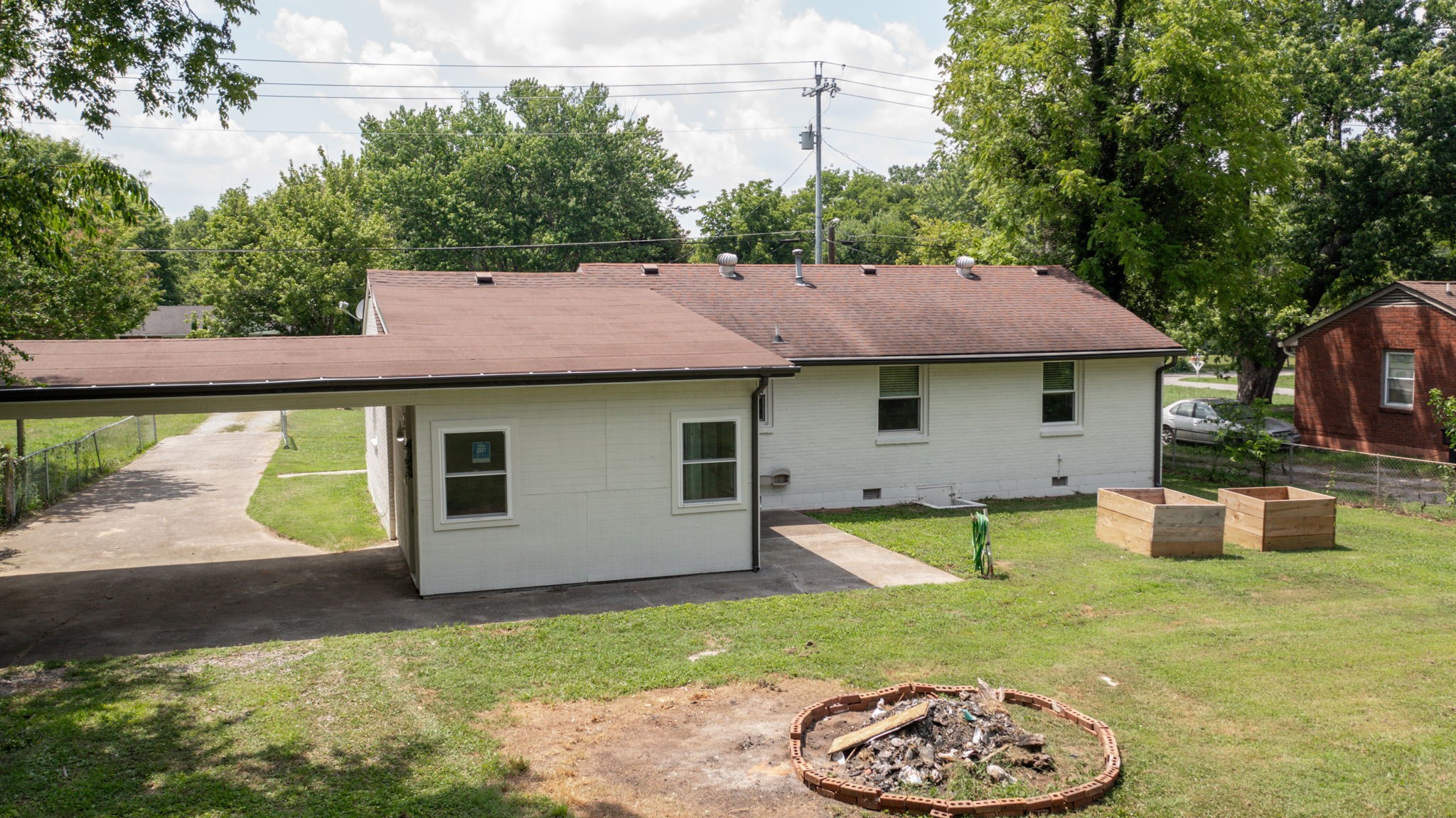 1007 Hunt Street Murfreesboro, TN 37130 - Photo 49 of 58 a view of a house with a yard and a garden