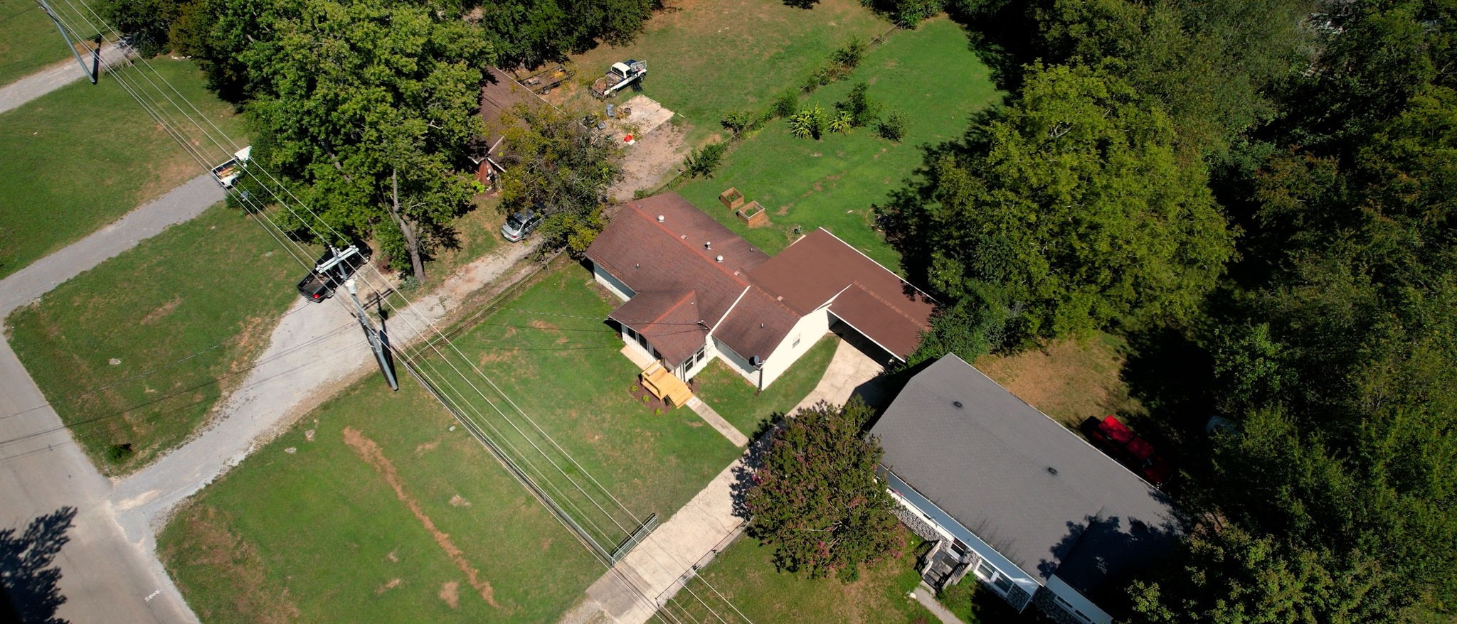 1007 Hunt Street Murfreesboro, TN 37130 - Photo 54 of 58 an aerial view of a house with outdoor space and a lake view