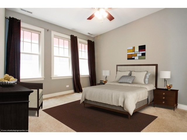 1148 West Monroe Street, Unit 5SW Chicago, IL 60607 - Photo 6 of 13 a bedroom with a bed and a table in it with window
