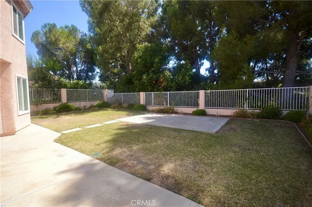 a view of swimming pool with outdoor seating and plants