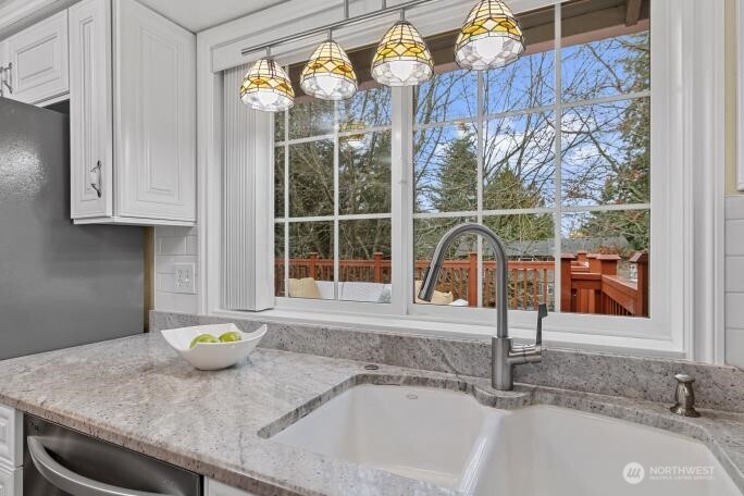 5527 153rd Street Southwest Edmonds, WA 98026 - Photo 14 of 40 a bathroom with a granite countertop sink and a window