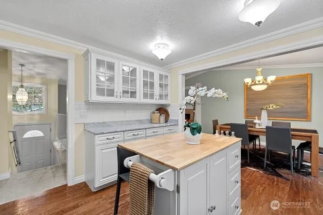 a view of a kitchen area with furniture and chandelier