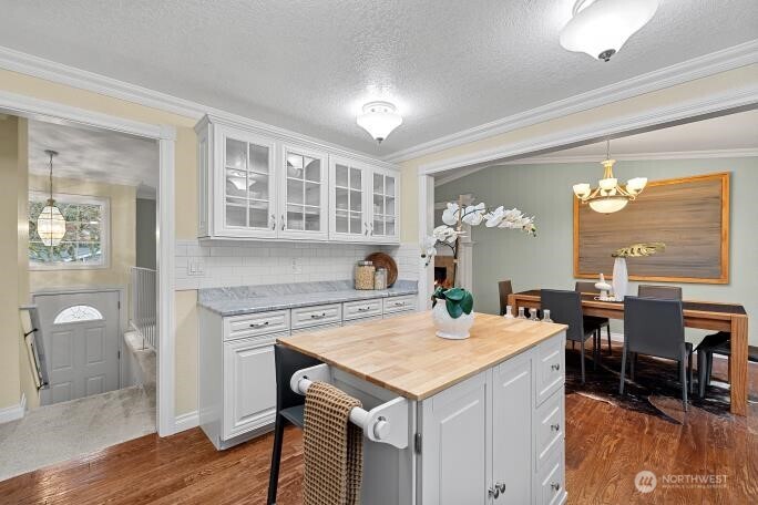 5527 153rd Street Southwest Edmonds, WA 98026 - Photo 15 of 40 a view of a kitchen area with furniture and chandelier