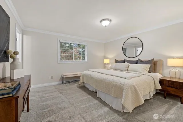 a bedroom with a bed and a fish aquarium