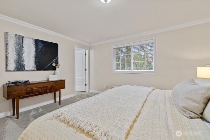 5527 153rd Street Southwest Edmonds, WA 98026 - Photo 21 of 40 a bedroom with a bed and a flat screen tv