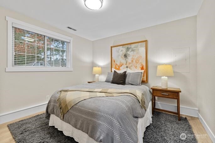 5527 153rd Street Southwest Edmonds, WA 98026 - Photo 23 of 40 a bedroom with a bed and a window