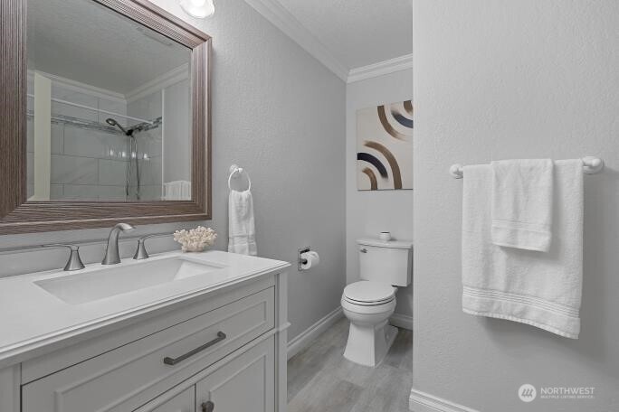 5527 153rd Street Southwest Edmonds, WA 98026 - Photo 25 of 40 a bathroom with a toilet sink and mirror