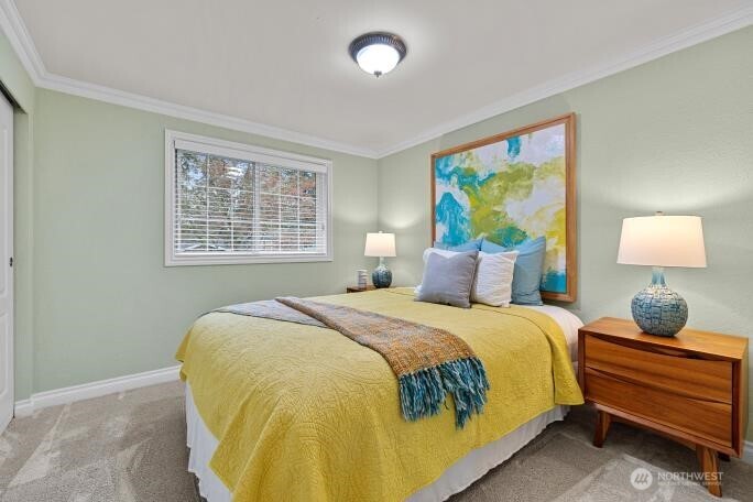 5527 153rd Street Southwest Edmonds, WA 98026 - Photo 26 of 40 a bedroom with a bed and a window
