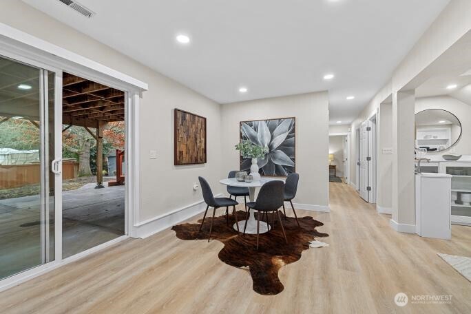 5527 153rd Street Southwest Edmonds, WA 98026 - Photo 32 of 40 a dining room with furniture and wooden floor