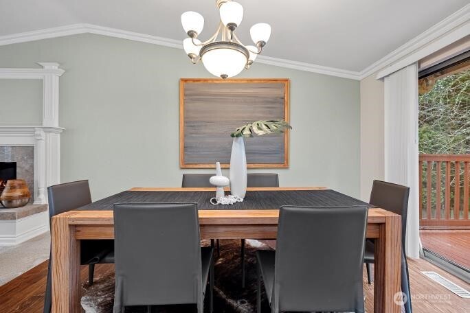 5527 153rd Street Southwest Edmonds, WA 98026 - Photo 8 of 40 a view of a dining room with furniture and chandelier