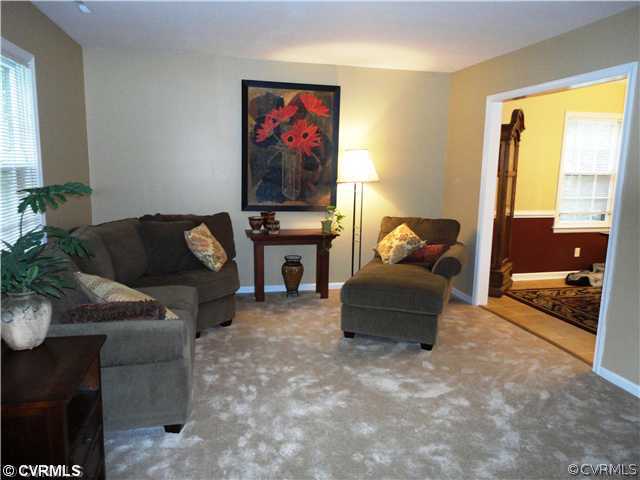 10649 Honey Tree Road Richmond, VA 23235 - Photo 7 of 12 Living Room - Living room has new wall to wall carpet.