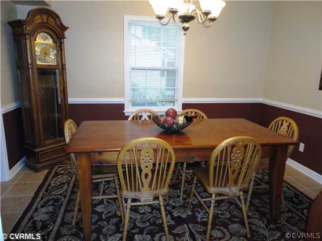 10649 Honey Tree Road Richmond, VA 23235 - Photo 8 of 12 Dining Room - The dining room includes a 5-arm "Pottery Barn" style chandelier, tile floor and chair rail.