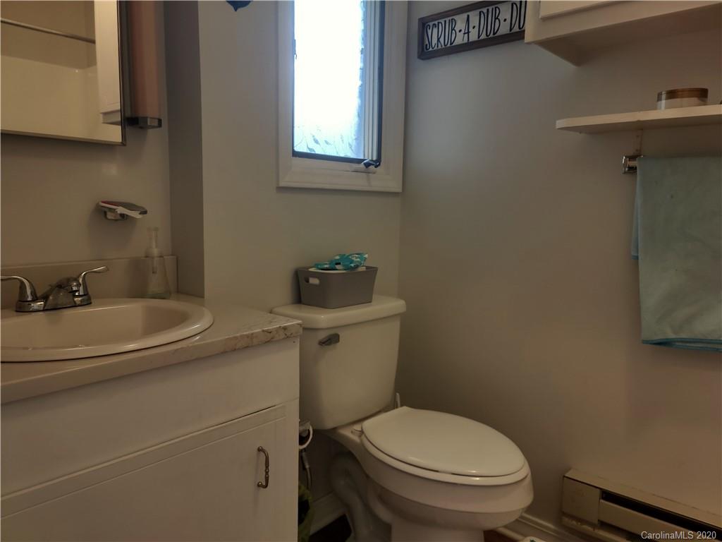 152 Willis Hill Road Canton, NC 28716 - Photo 15 of 34 a bathroom with a sink toilet and a mirror