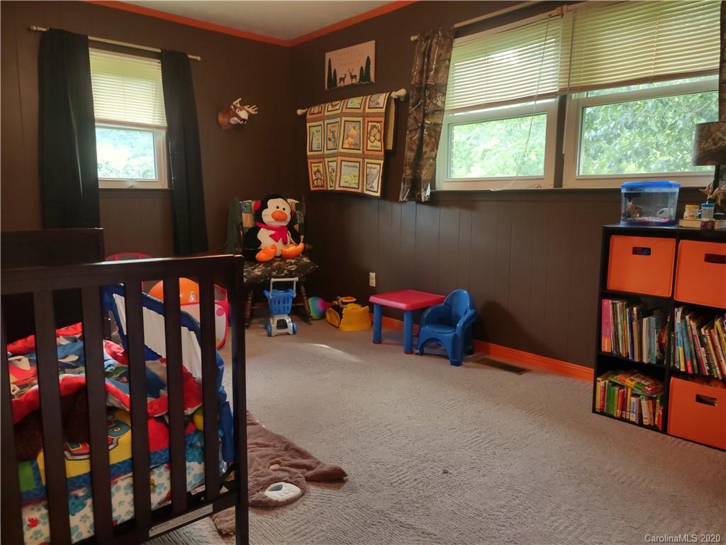 152 Willis Hill Road Canton, NC 28716 - Photo 16 of 34 a children room with toys and a window