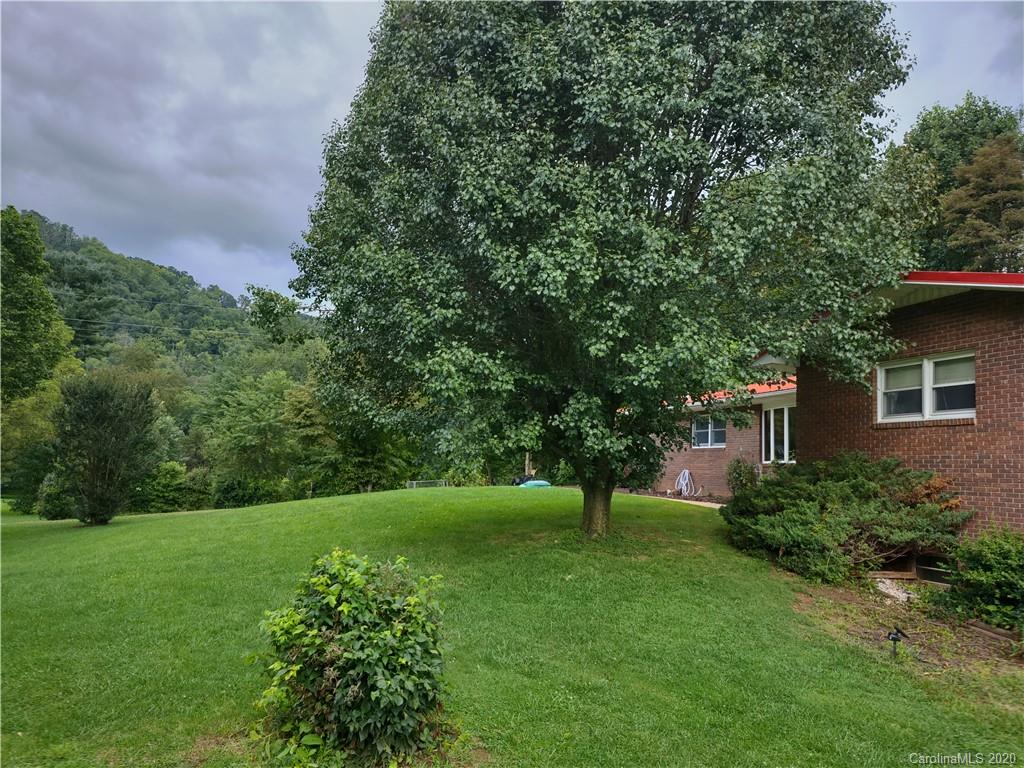 152 Willis Hill Road Canton, NC 28716 - Photo 24 of 34 a view of a backyard with a garden