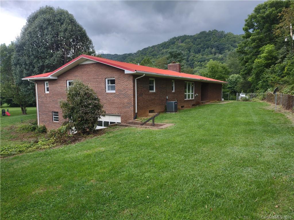 152 Willis Hill Road Canton, NC 28716 - Photo 26 of 34 a front view of a house with garden
