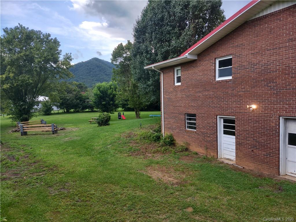 152 Willis Hill Road Canton, NC 28716 - Photo 28 of 34 a front view of a house with garden