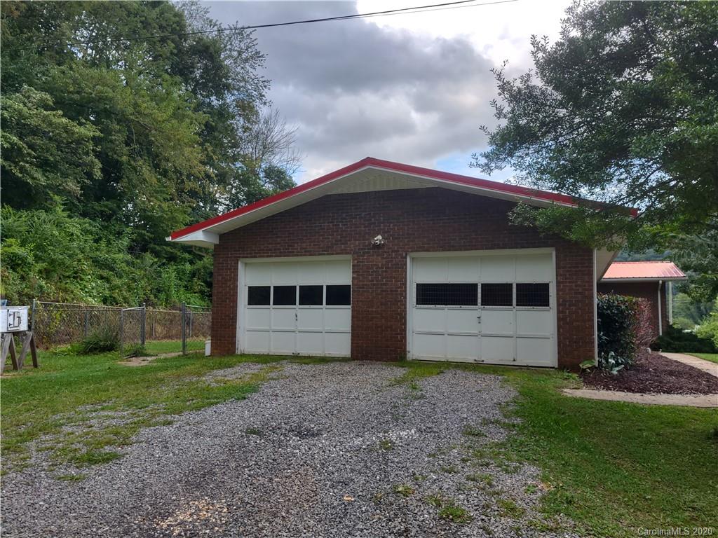 152 Willis Hill Road Canton, NC 28716 - Photo 29 of 34 a view of a house with yard and a garden