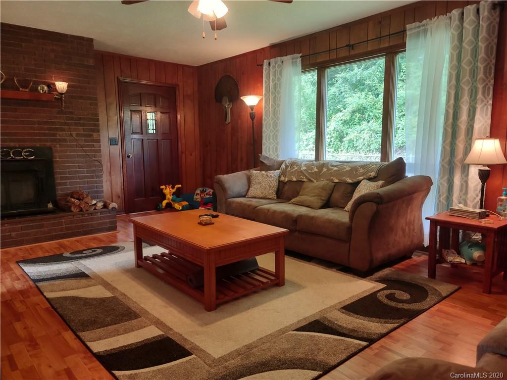 152 Willis Hill Road Canton, NC 28716 - Photo 4 of 34 a living room with furniture and a large window