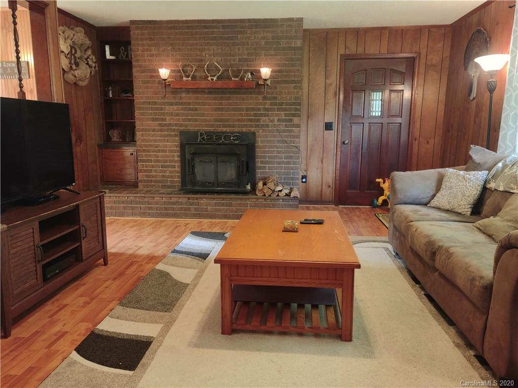 152 Willis Hill Road Canton, NC 28716 - Photo 5 of 34 a living room with furniture and a fireplace