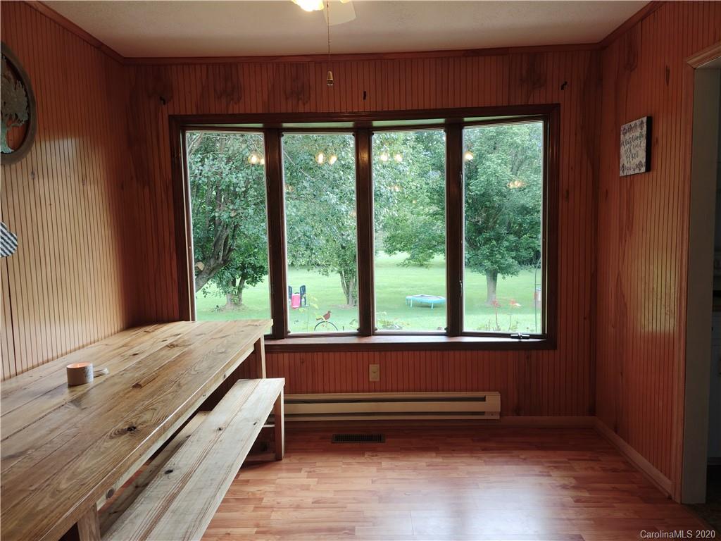 152 Willis Hill Road Canton, NC 28716 - Photo 8 of 34 a bathroom with a window double vanity sink and mirror