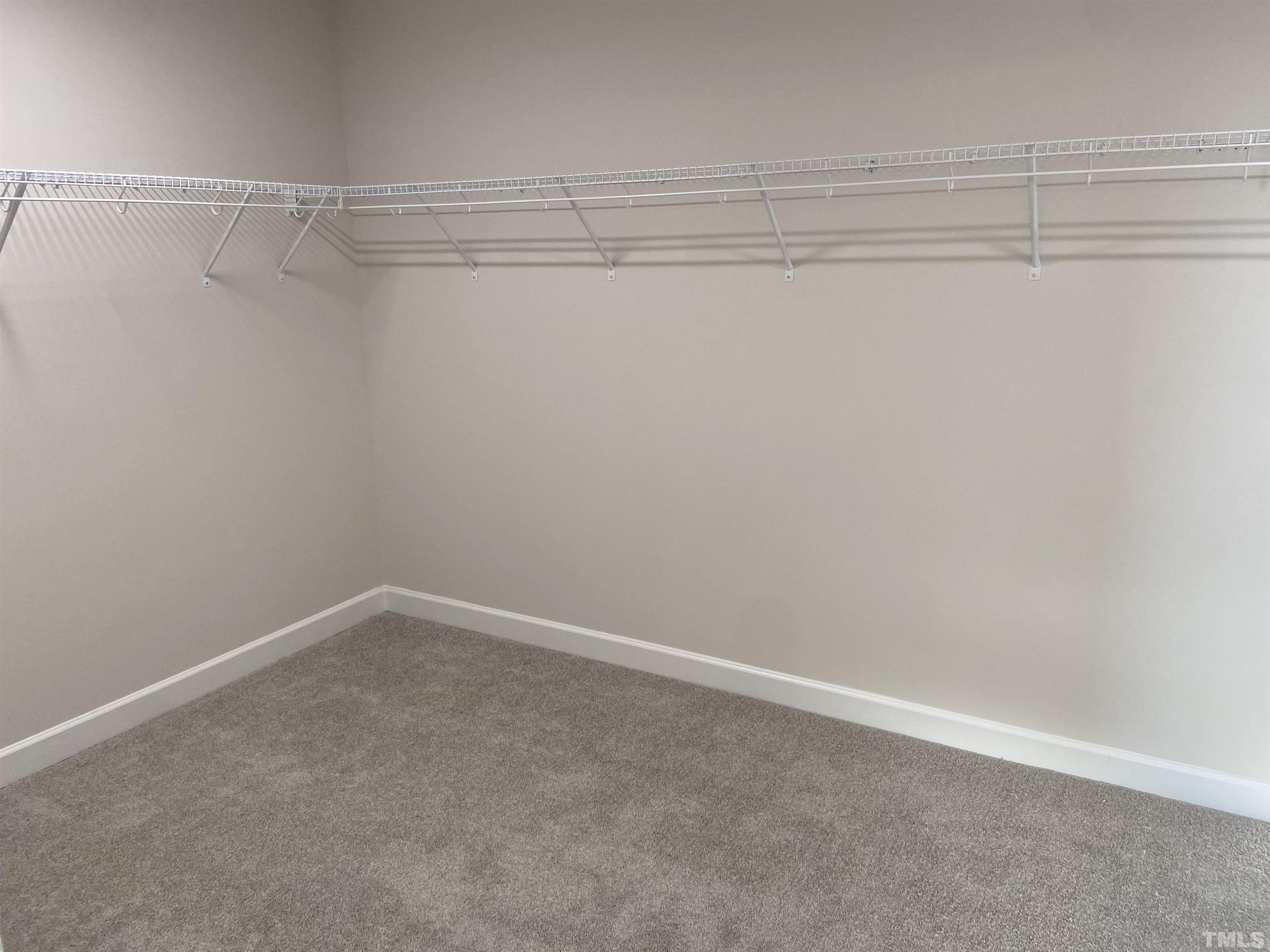 120 Yulan Way Garner, NC 27529 - Photo 12 of 30 a view of a room with racks on the wall