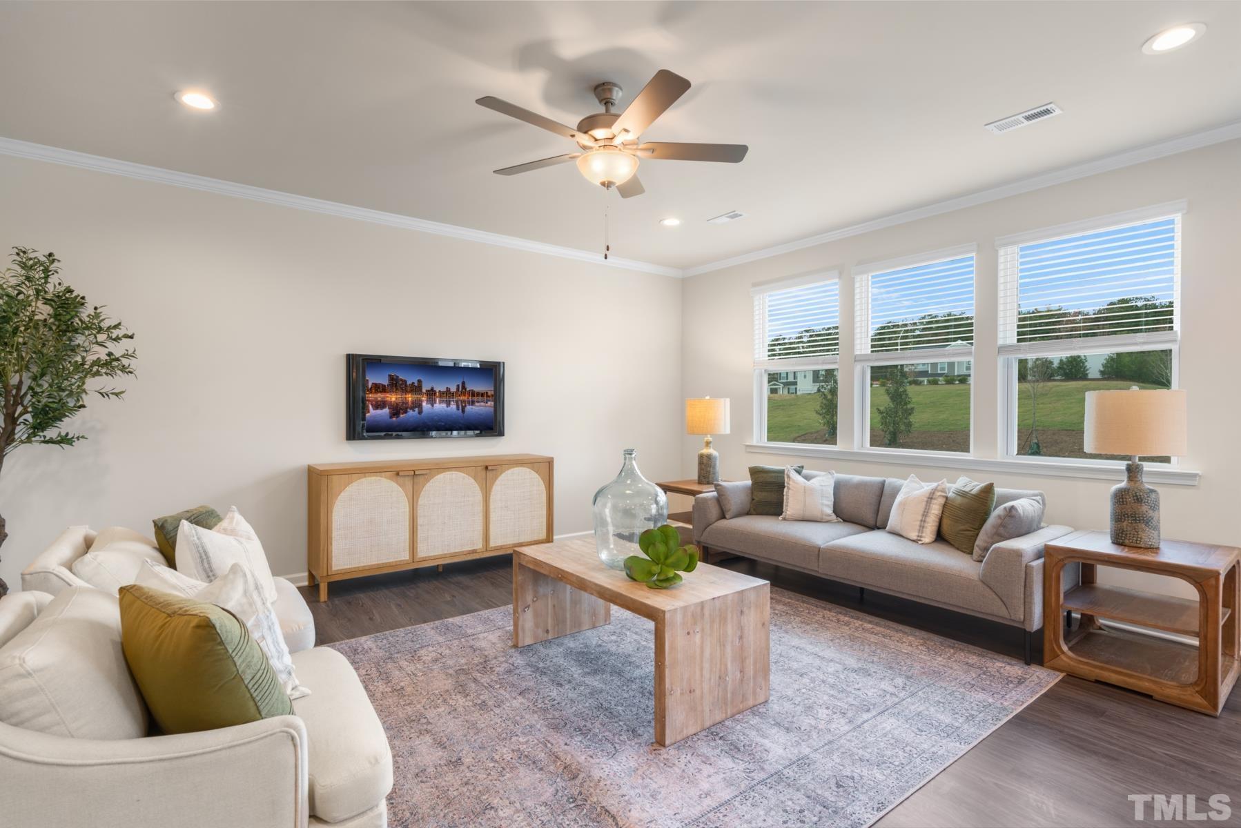 120 Yulan Way Garner, NC 27529 - Photo 17 of 30 a living room with furniture and a large window