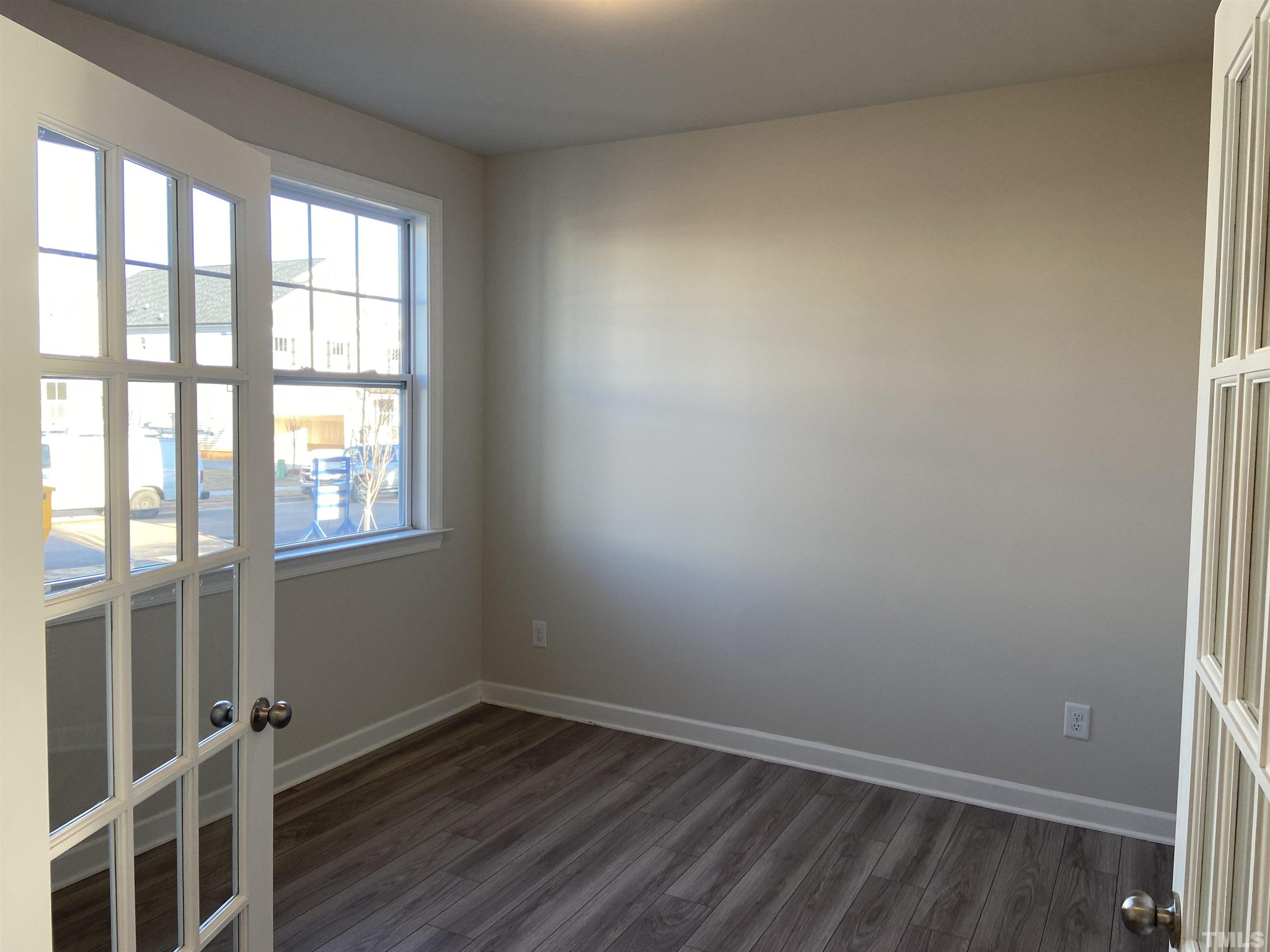 120 Yulan Way Garner, NC 27529 - Photo 2 of 30 wooden floor in an empty room with a window