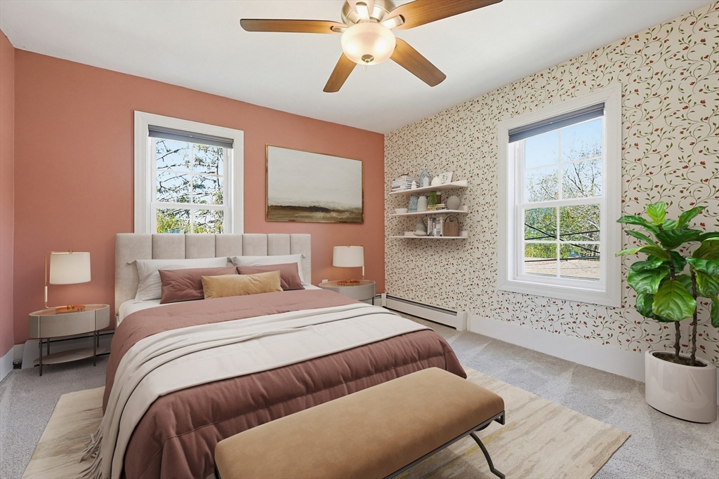 44 Clark Street Spencer, MA 01562 - Photo 20 of 41 a bedroom with bed a couch and potted plant