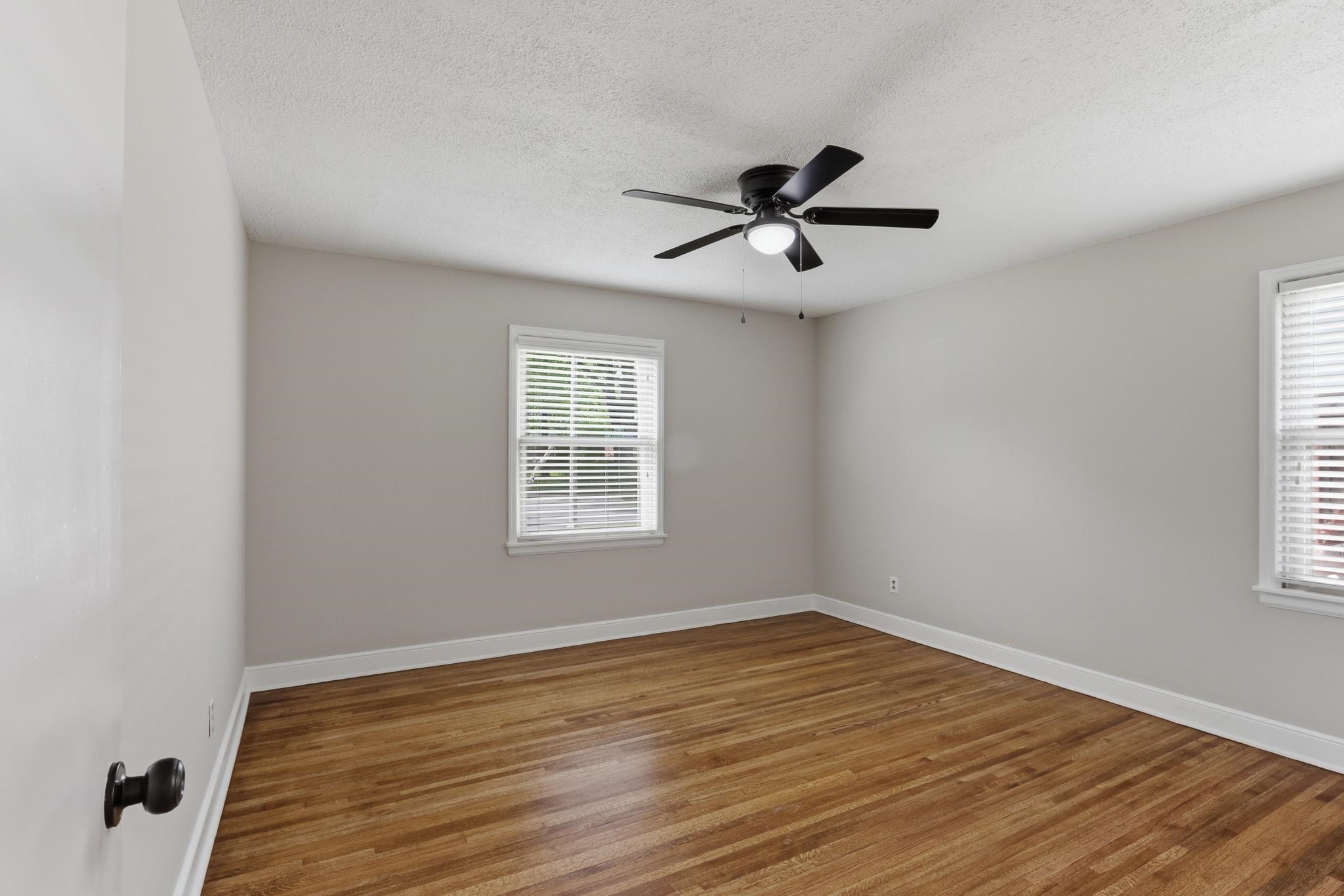 312 Fernway Road Memphis, TN 38117 - Photo 25 of 38 Spare room featuring wood finished floors, ceiling fan, and a textured ceiling