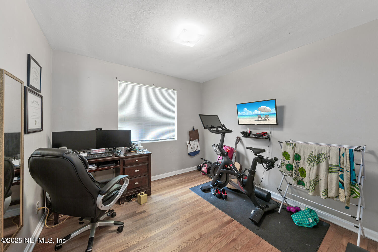 8309 Calento Street Jacksonville, FL 32211 - Photo 15 of 22 a view of a workspace with furniture and a window