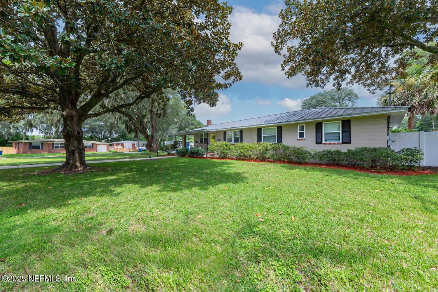 8309 Calento Street Jacksonville, FL 32211 - Photo 2 of 22 a house view with a garden space